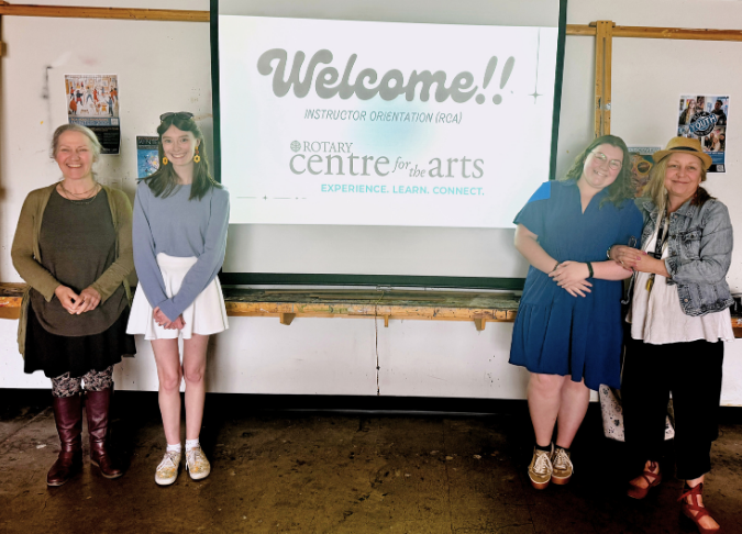 UBCO students Nicole and Elise pose happily with the Educational Programs Coordinator and RCA teacher for a photo.