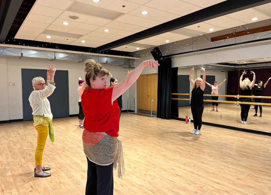 Participants of the Dance Around The World Program dancing with instructor Tascheleia Marangoni